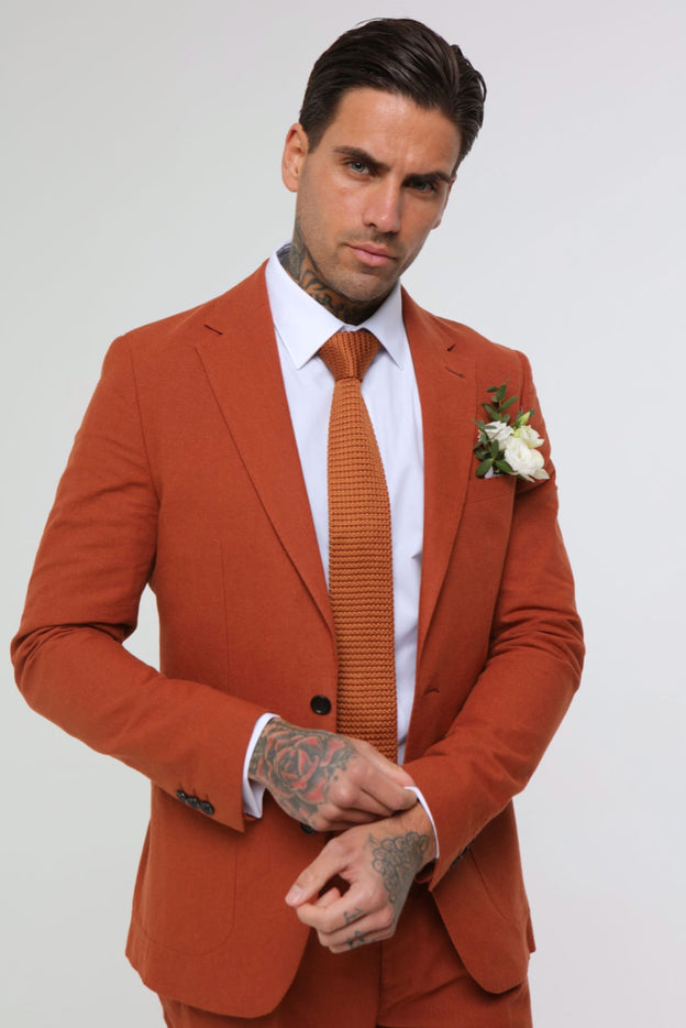 Elevate your style and make a lasting impression with our Clay Linen Blazer. Made with high-quality linen material, this blazer is perfect for special events and occasions. 